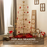 RADYAN wrought iron tiered folding stand displaying hanging Christmas ornaments on a decorated tree