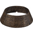 Handwoven hyacinth Christmas tree collar with braided design wrapped around a tree base