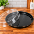 Bake, Take, and Show 10 1/4" Round Black Oven-Safe Cookie, cakes, pies Takeout Tray with Clear Lid