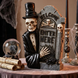 12 in. Halloween Skeleton Holding a Tombstone Decoration