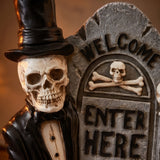 12 in. Halloween Skeleton Holding a Tombstone Decoration