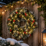 Pre-Lit 24 in. Crestwood Spruce Christmas Wreath with Warm White LED Lights, Battery Operated Timer Door Decoration