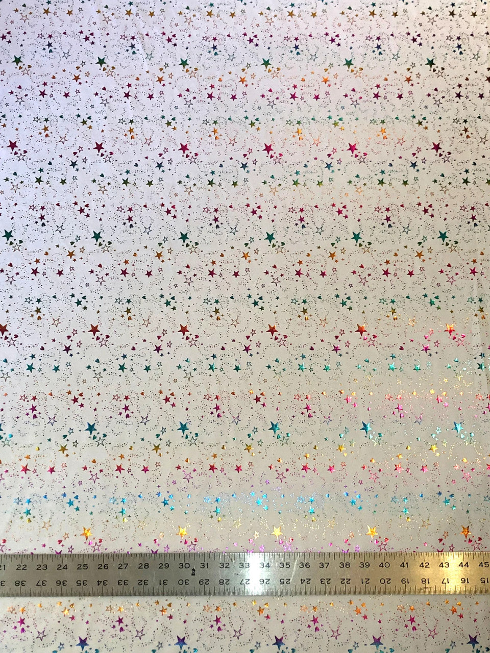 Small Multi Color Foil Stars And Hearts On White Nylon Spandex Knit Fabric - White Multi Color Foil Stars And Hearts, 58" Width