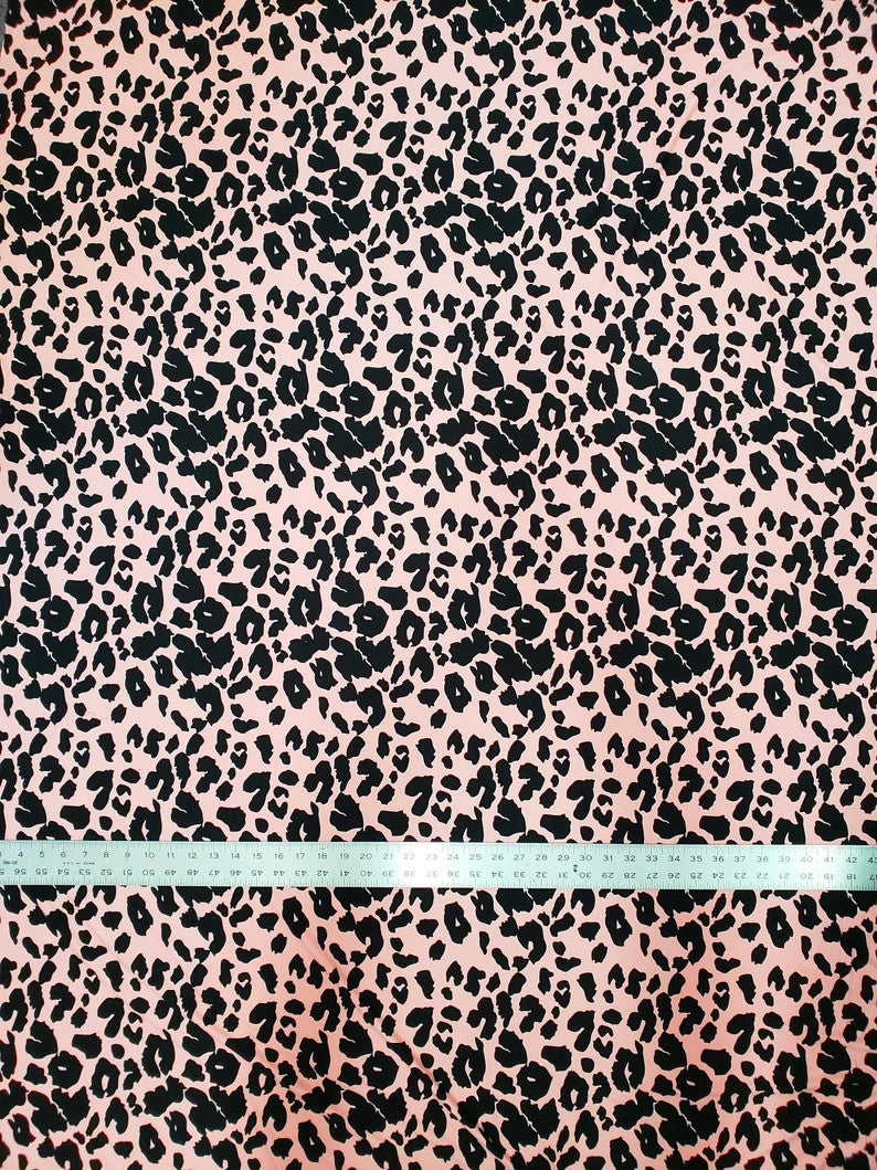 Polyester Spandex Brushed Single Span Fabric - Peach & Black Animal Print, 58" To 60" Width