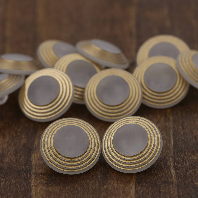 Clear Plastic Shank Button with Gold Rims
