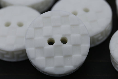 Plastic Button White Texturized Checkered 34L