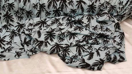 Rayon Challis Black Palm Tree on Baby Blue Background