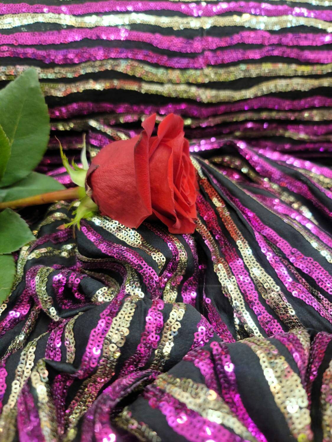 Sequin Fabric on Black Jersey Knit Gold and Fuchsia