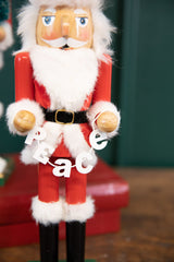 15" Santa Nutcracker with Peace Garland
