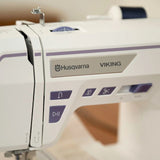 Husqvarna Viking Designer Quartz 29 Sewing Embroidery Machine - 250 Stitches, 180 Embroidery Designs, 7" Color Touch Screen (1 Unit)