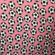 Soccer Balls on Pink Fleece Fabric