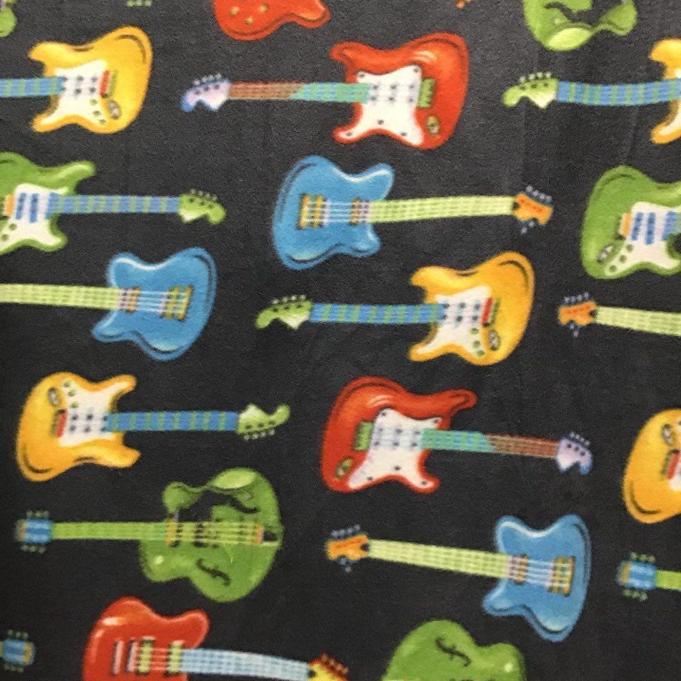 Rock star Colored Guitars on Black Anti Pill Fleece Fabric,